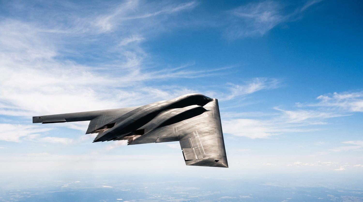 A B-2 stealth bomber in flight, a low-observable airframe where a bare conductive carbon-fiber skin would reflect rather than absorb radar.